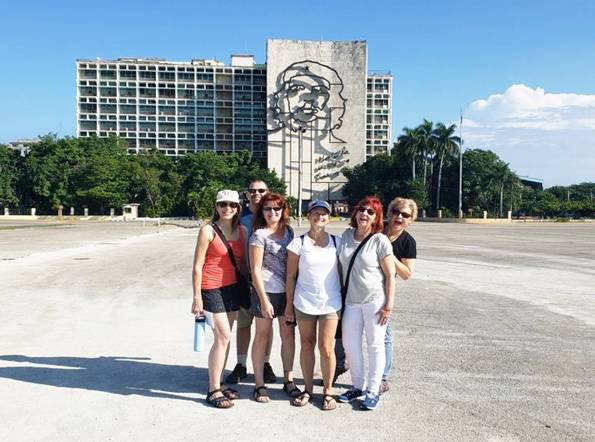  A group of travelers visiting the Plaza de la Revolucion in Havana
