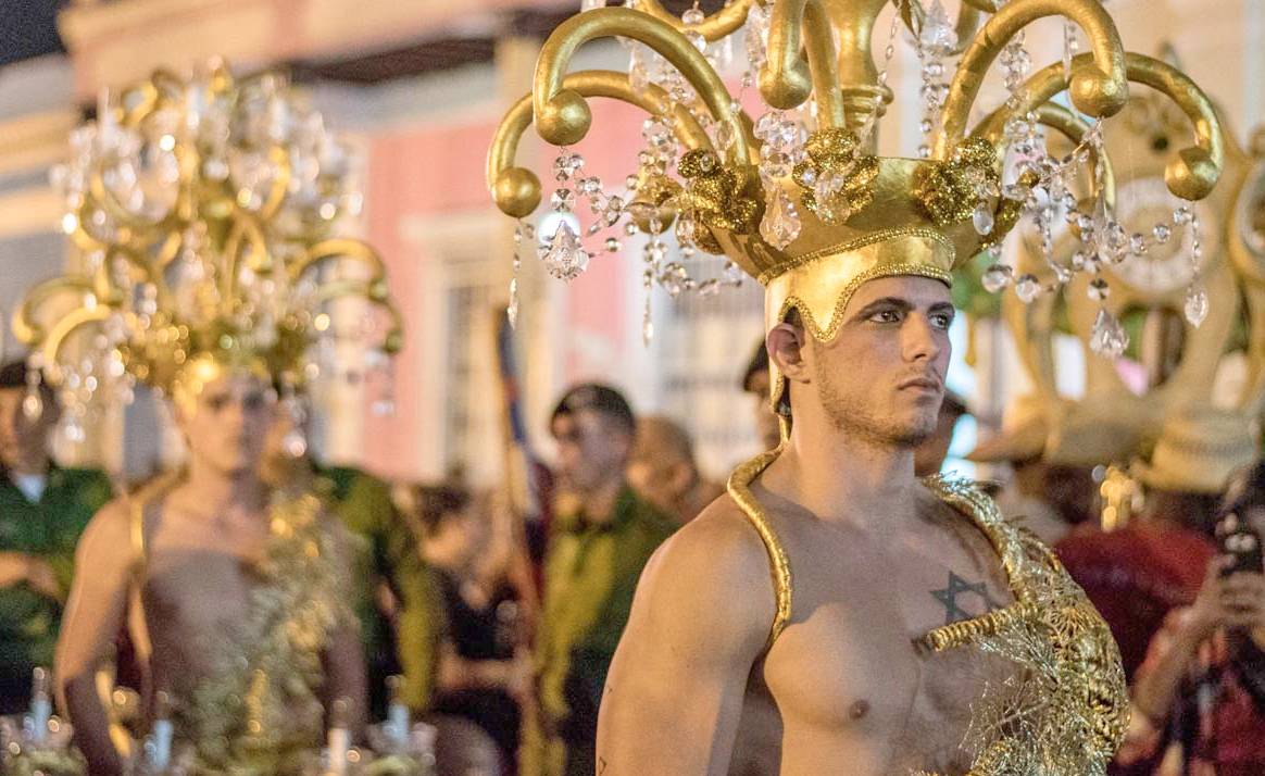 A carnival parade during the Parrandas de Remedios festival, Cuba A man dressed in carnival costume during the Parrandas de Remedios festival, Cuba.