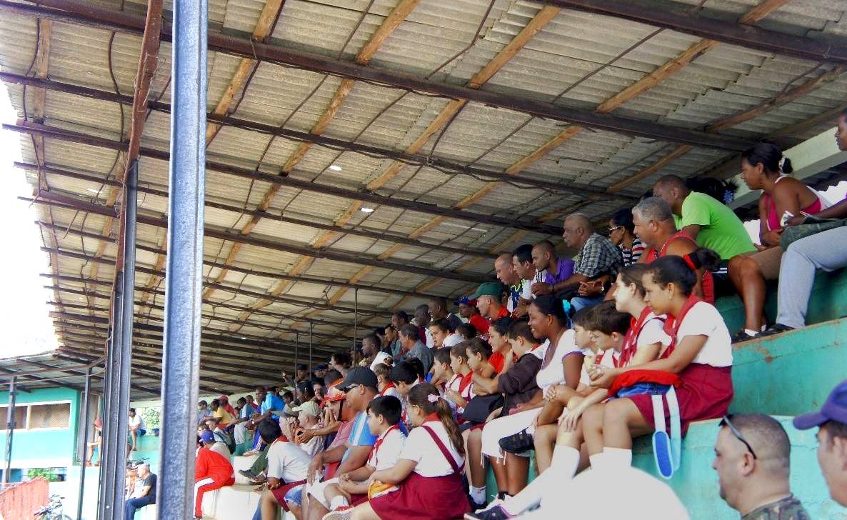 A crowd at an international friendship match in Viñales with a team from San Diego, California a crowd on the stands at a Cuban baseball game
