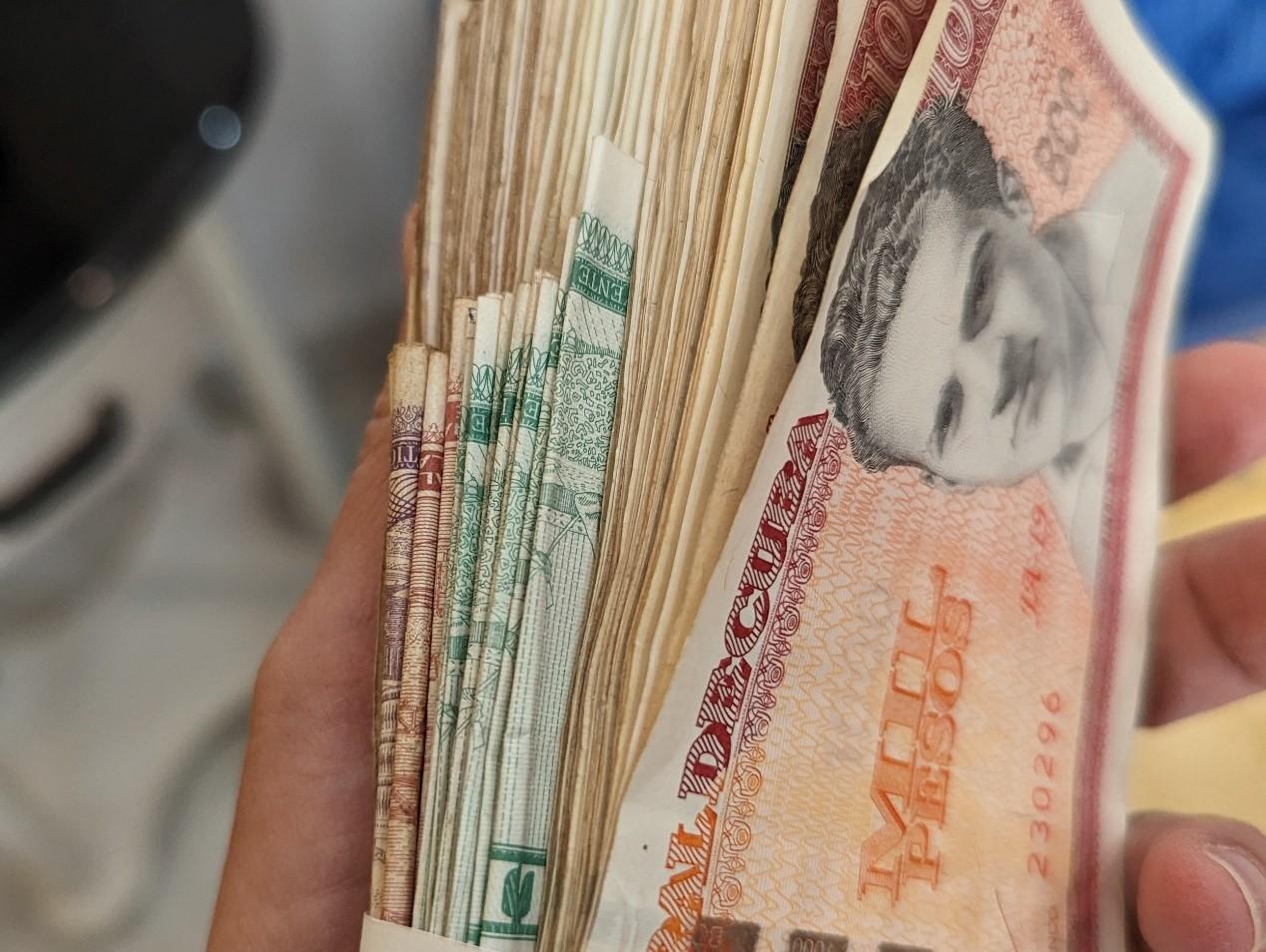 a handful of Cuban peso bills