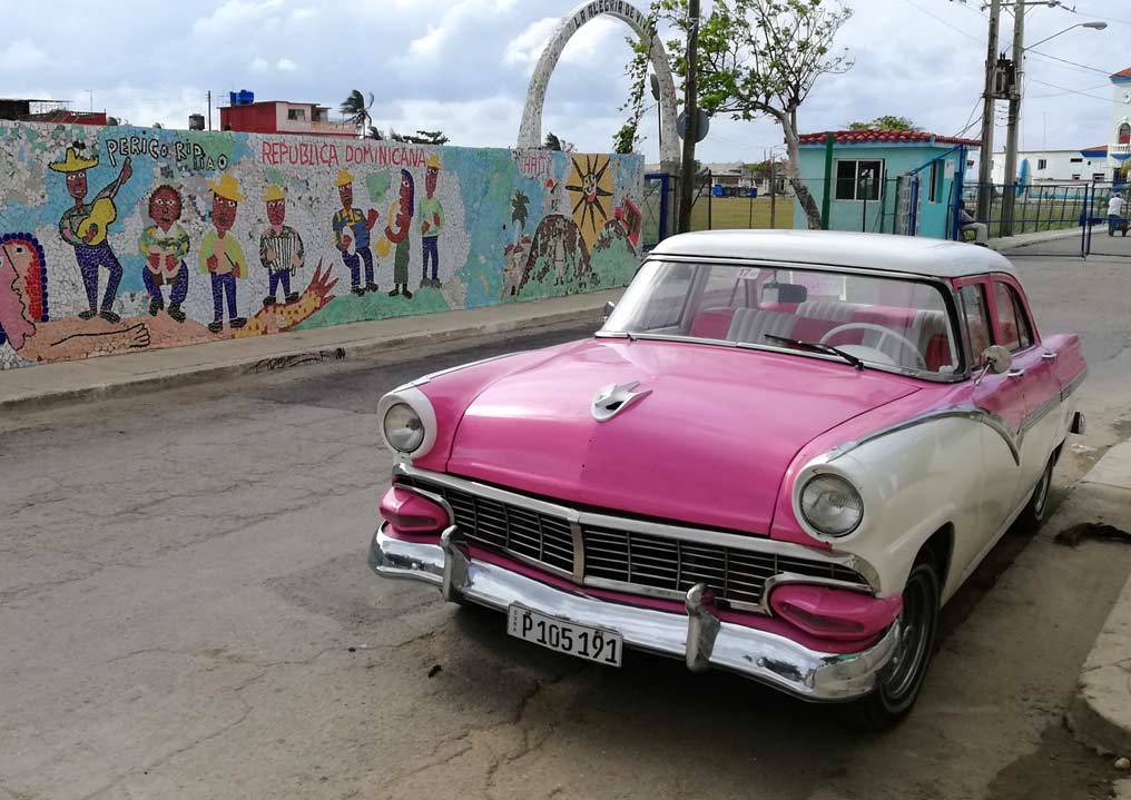 A pink 1950's American car in Fusterlandia in Havana A pink 1950's American car in Fusterlandia in Havana
