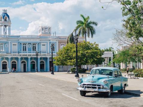 A sky blue 1950’s Chevy in a plaza in the city of Cienfuegos, Cuba
