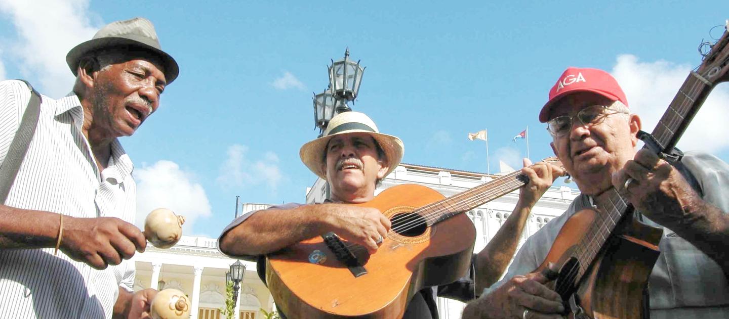 A trio of musicians playing in Santiago de Cuba