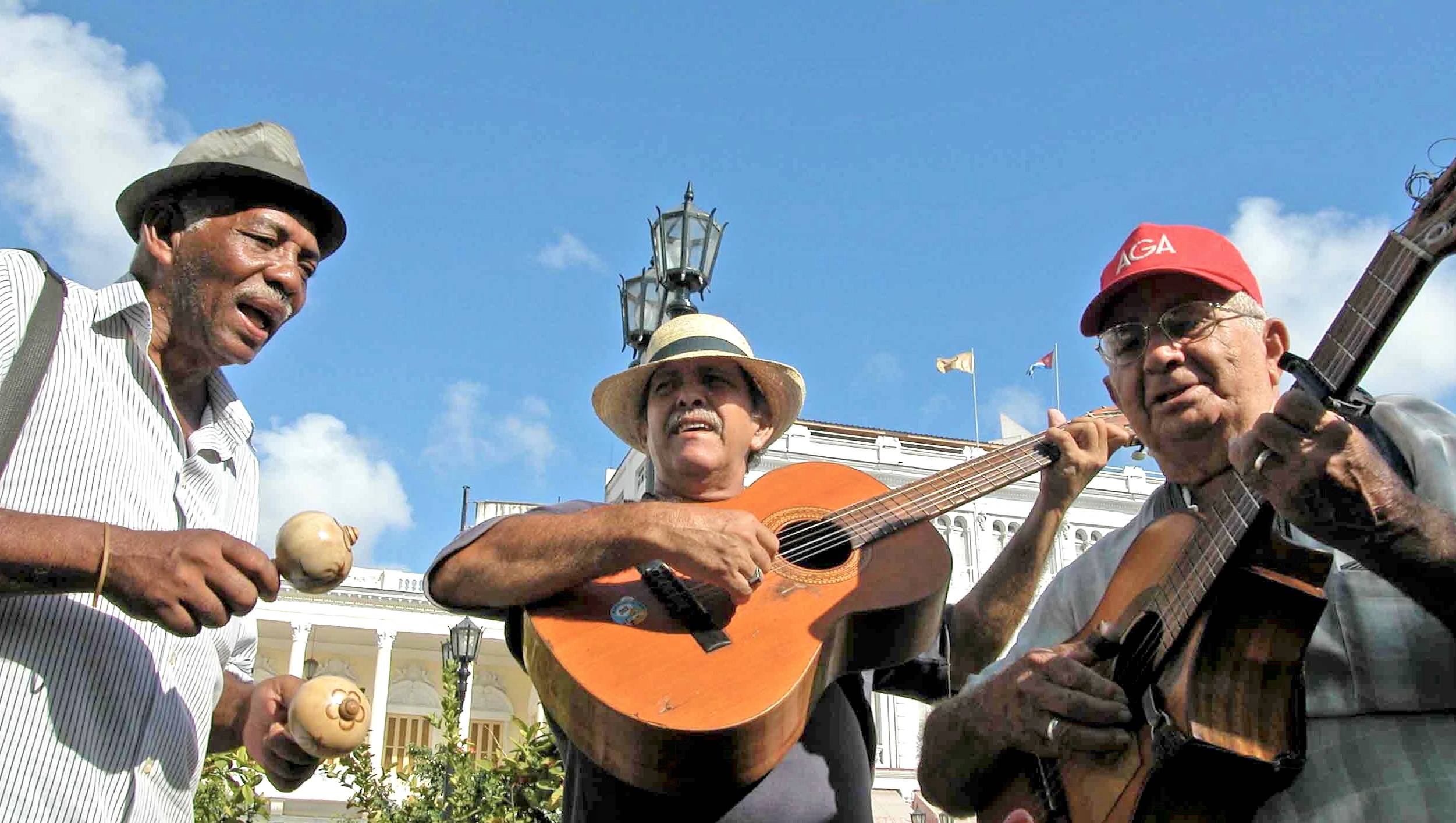 A trio of musicians in Parque Cespedes in Santiago de Cuba A trio of musicians in Parque Cespedes in Santiago de Cuba