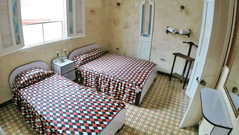 An image of a simple guesthouse room in Havana, Cuba. An image of a simple guesthouse room in Havana, Cuba.
