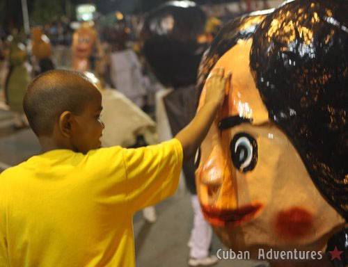Big head doll with child in Santiago de Cuba's Carnival Big head doll with child in Santiago de Cuba's Carnival