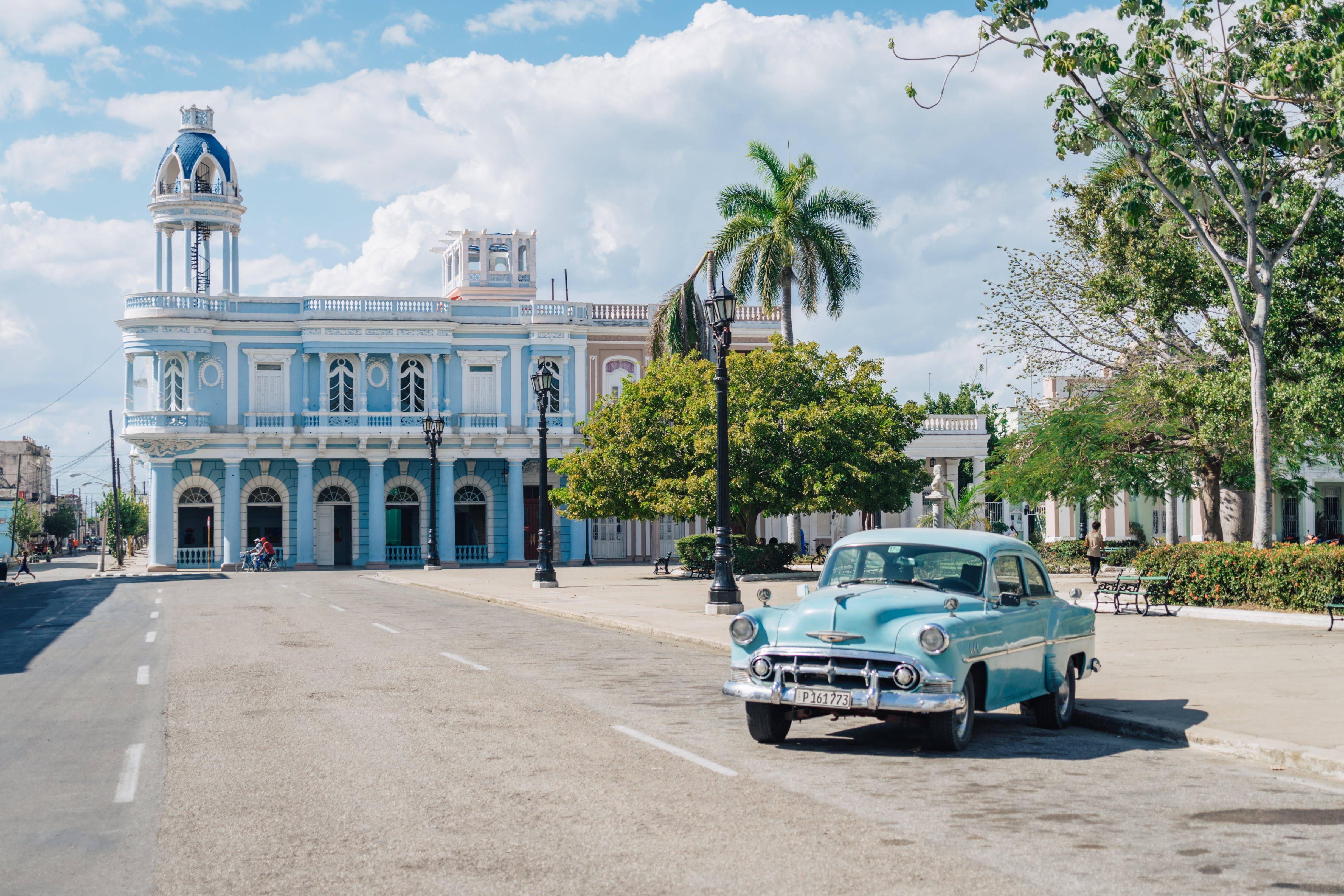 Classic car in front of Palacio Ferrer in Cienfuegos Classic car in front of Palacio Ferrer in Cienfuegos