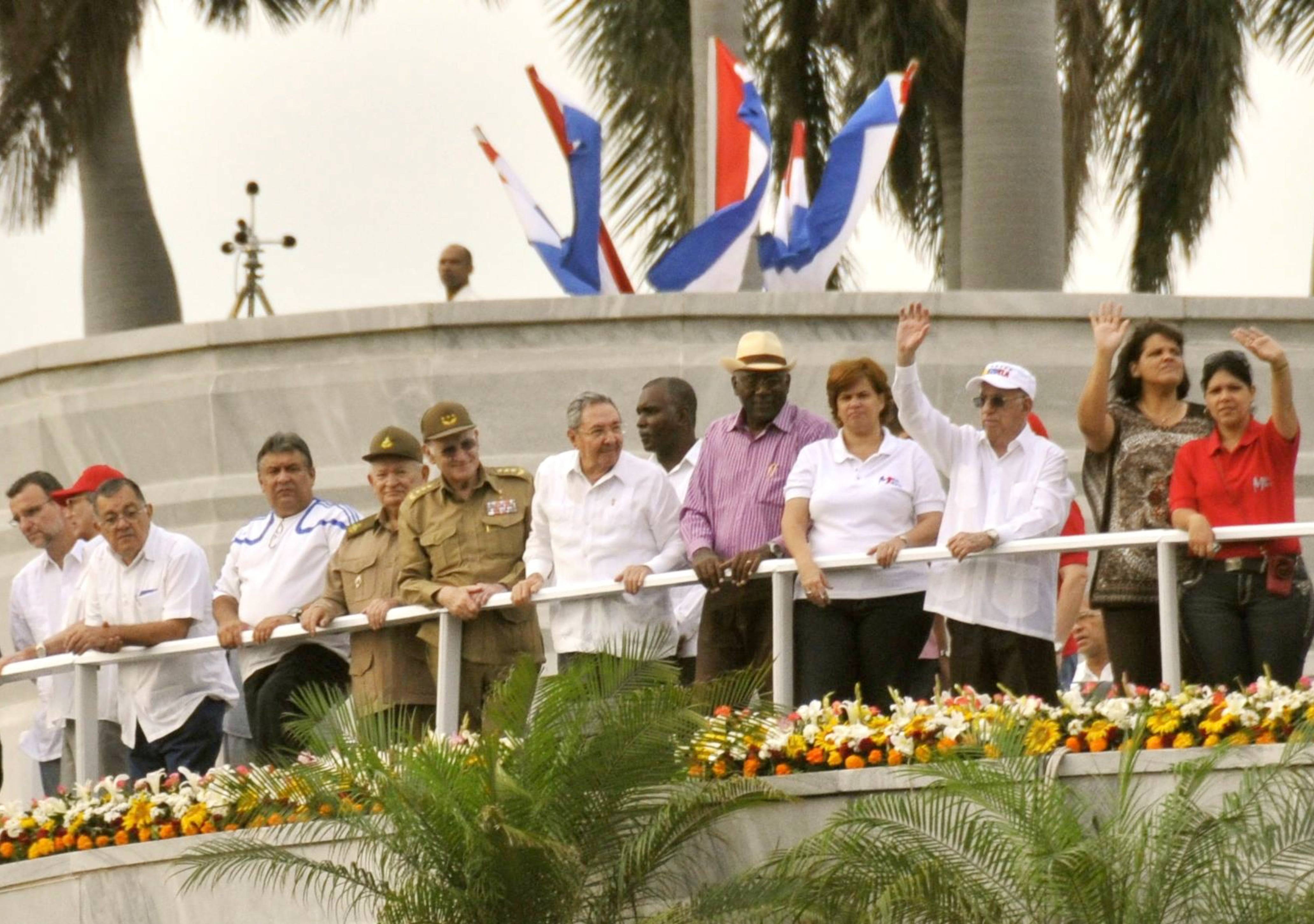 Cuban leaders, including Raul Castro, salute the crowd during the march Cuban leaders, including Raul Castro, salute the crowd at the May Day Parade in Havana