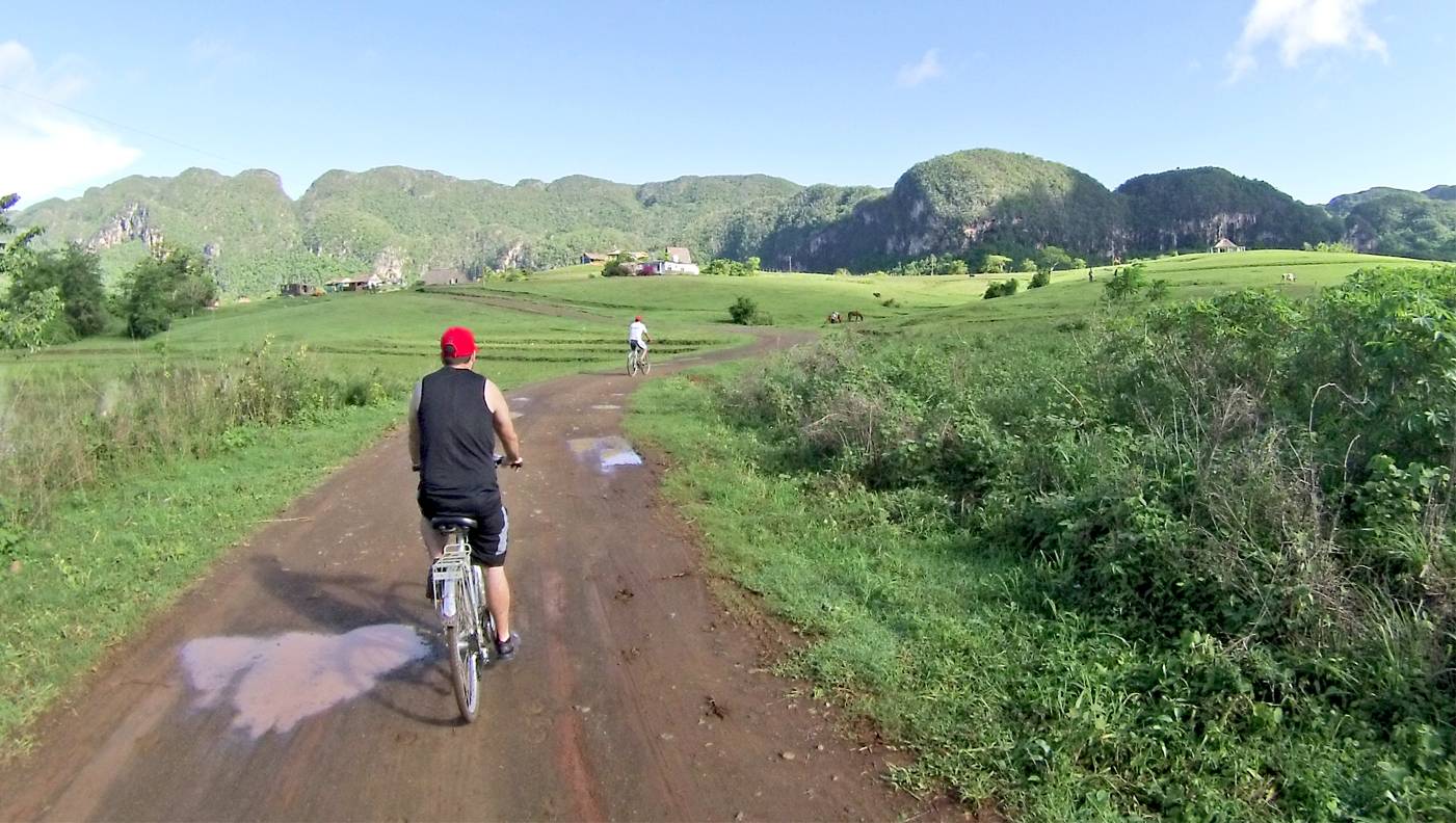 Cycling through Vinales valley in Cuba Cycling through Vinales valley in Cuba