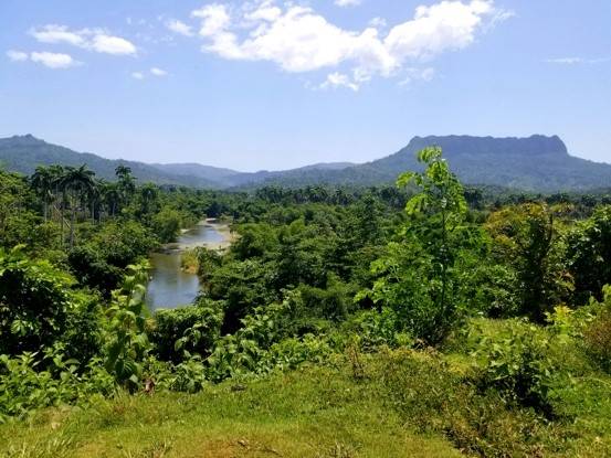 El Yunque National Park and Duaba River, Baracoa lush green landscape panorama showing Duaba river and the flat-topped Yunque mountain