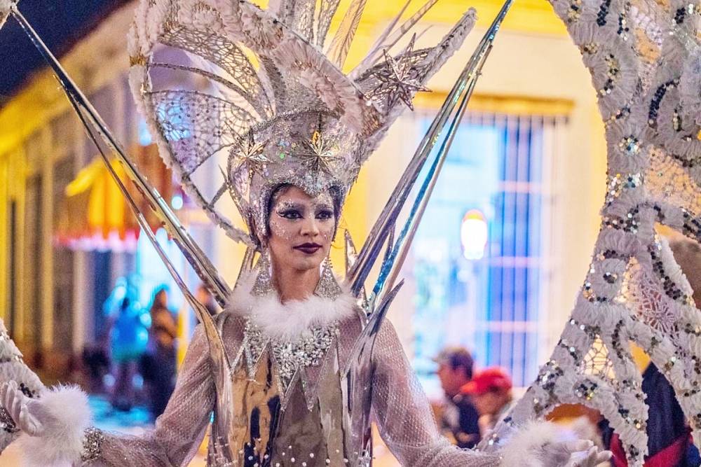 Elaborate costumes at the Parrandas de Remedios festival A brightly dressed participant in the Parrandas de Remedios festival in Cuba
