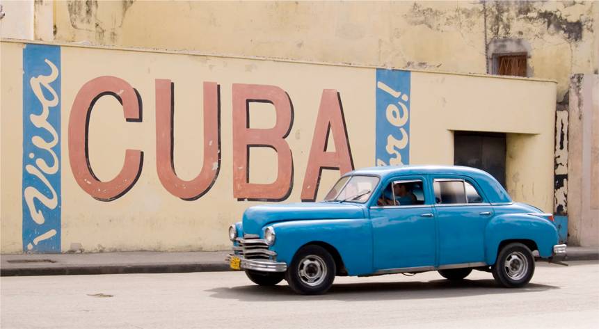 Freedom for Cuba is a universal desire. The question is how to achieve it. Photo: Getty A wall painting in Havana urging liberty for Cuba