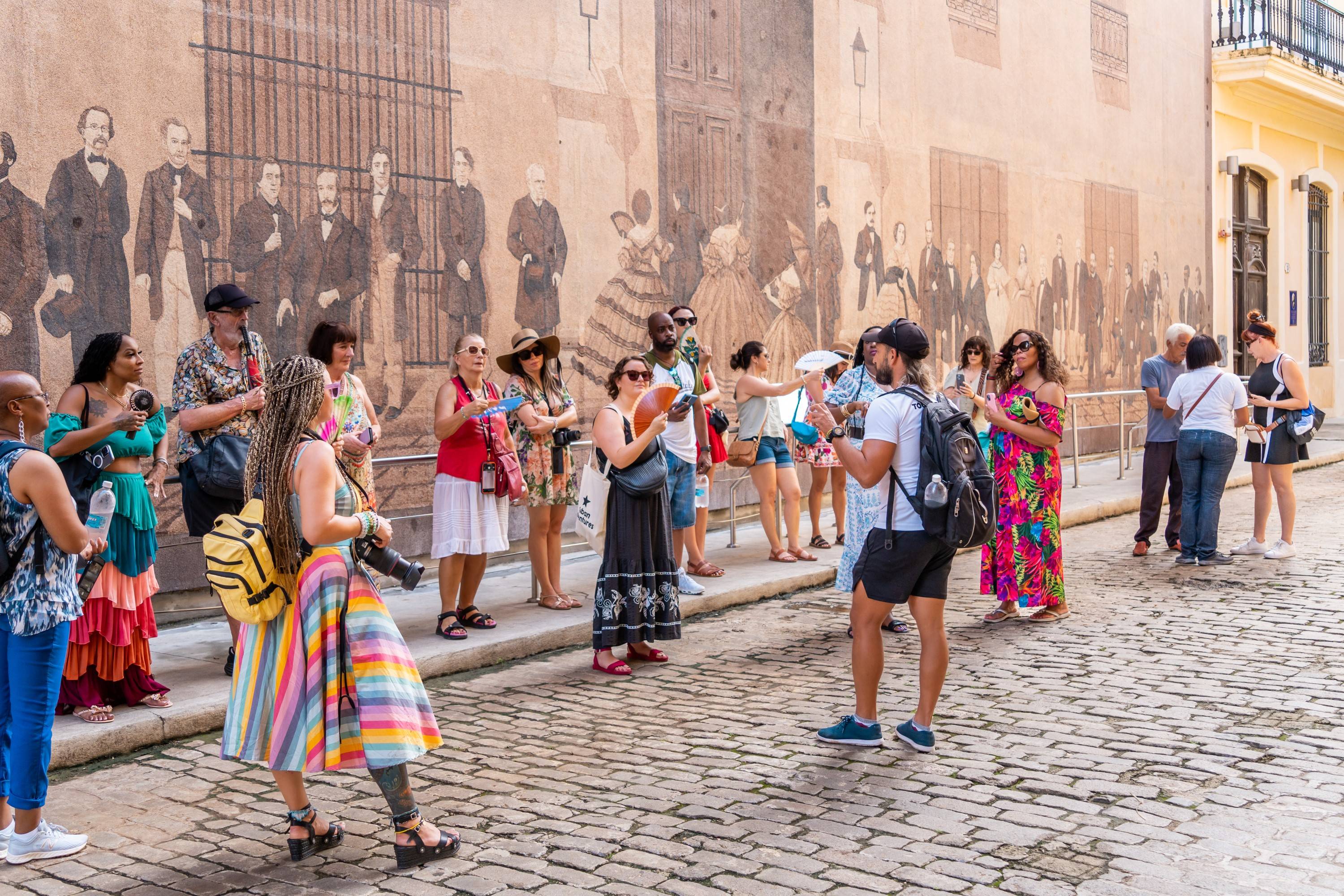 Group with tour leader by Historic Wall Mural Group with tour leader by Historic Wall Mural