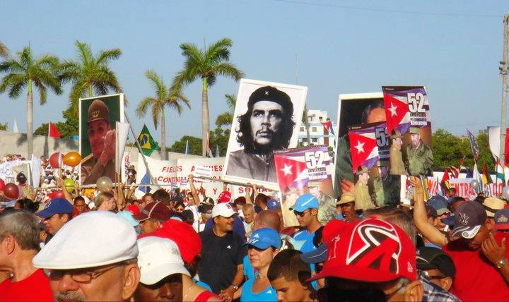 May day parade in Havana with Cuban flags and a poster of Che Guevara