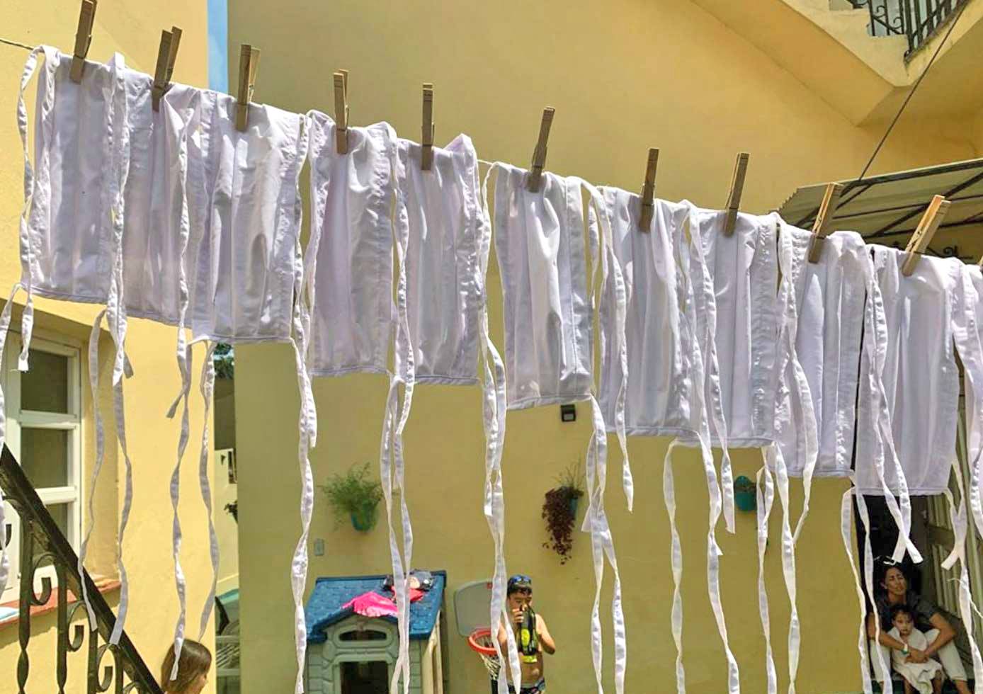 Reusable face masks being washed in Havana Reusable face masks being washed in Havana