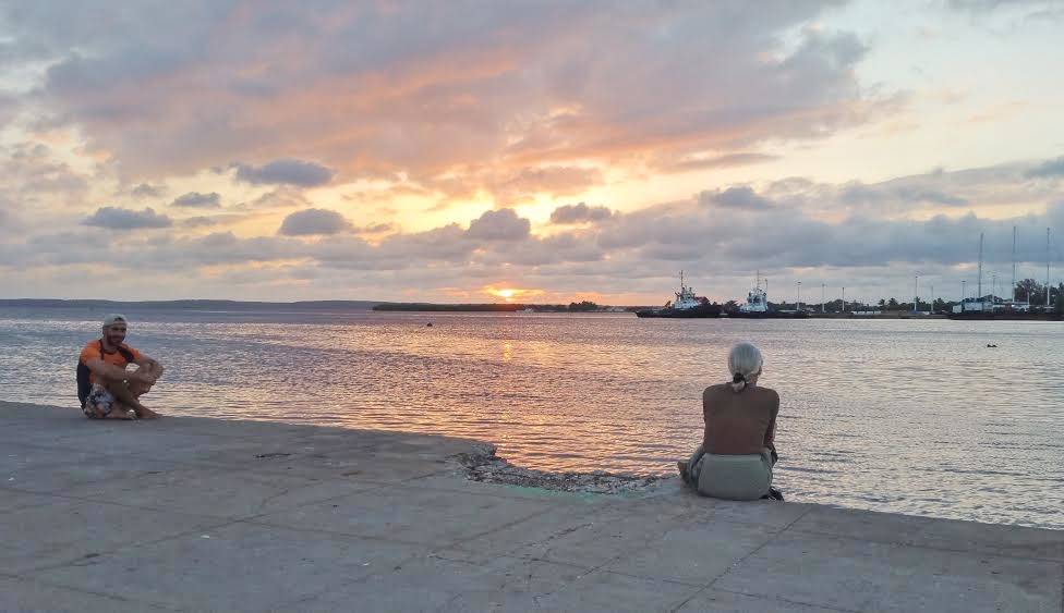 Sunset on the boulevard in Cienfuegos Sunset over the bayside boulevard in Cienfuegos