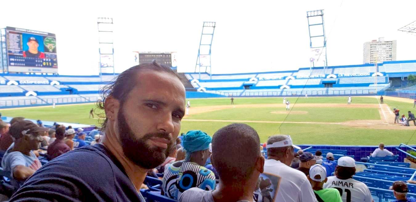 This is me hoping for a win from my team, Industriales selfie of author at a baseball game