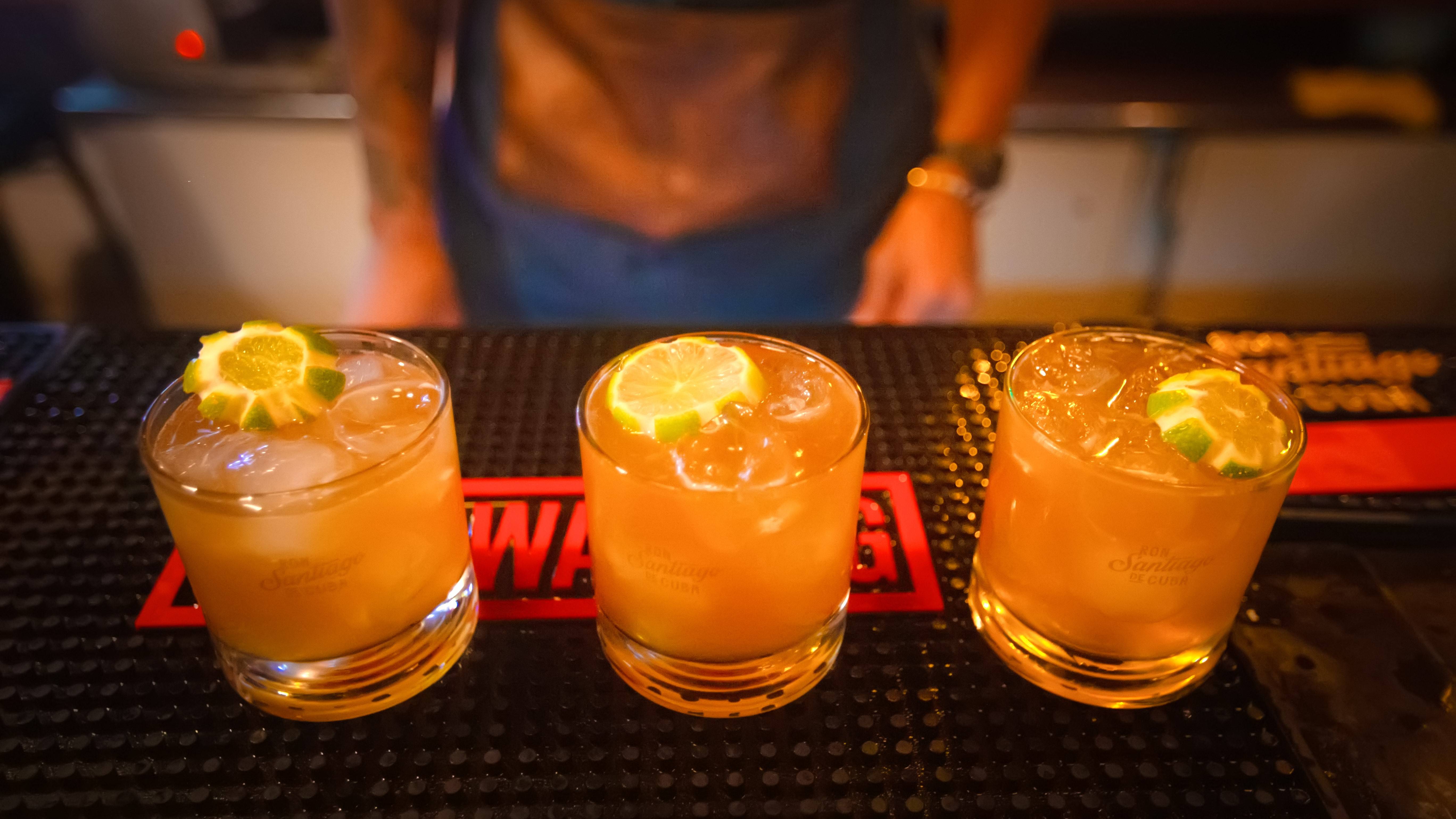 three cocktails on a bar mat three cocktails on a bar mat