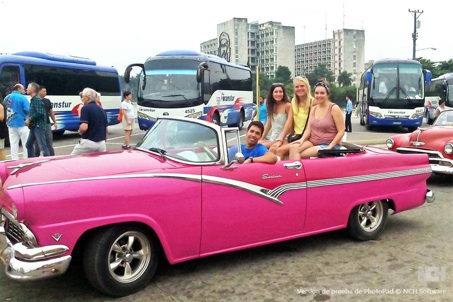 Tour guide Armando Lee Socarras with 3 happy customers in his Ford Fairline '56 that he and his father painted pink only recently.