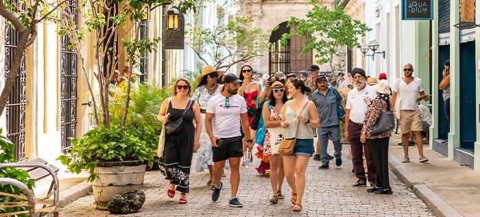 Tourists stroll along the boulevard