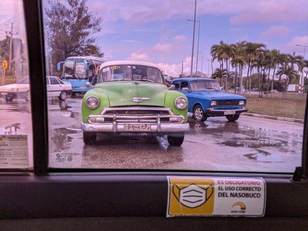 Traffic shown out of the window of a taxi