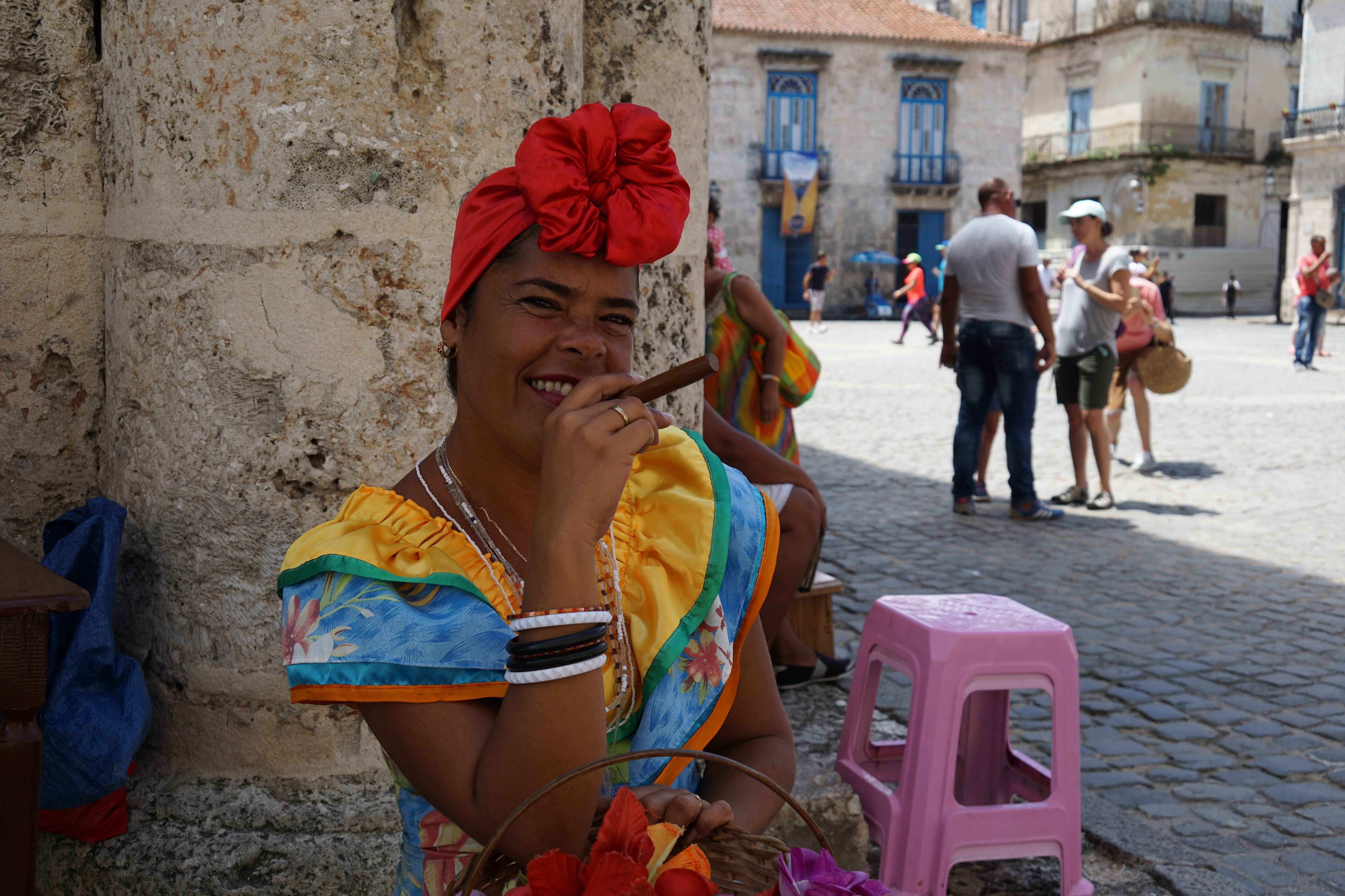 Woman smoking a Cuban cigar in Havana Vieja Woman smoking a Cuban cigar in Havana Vieja