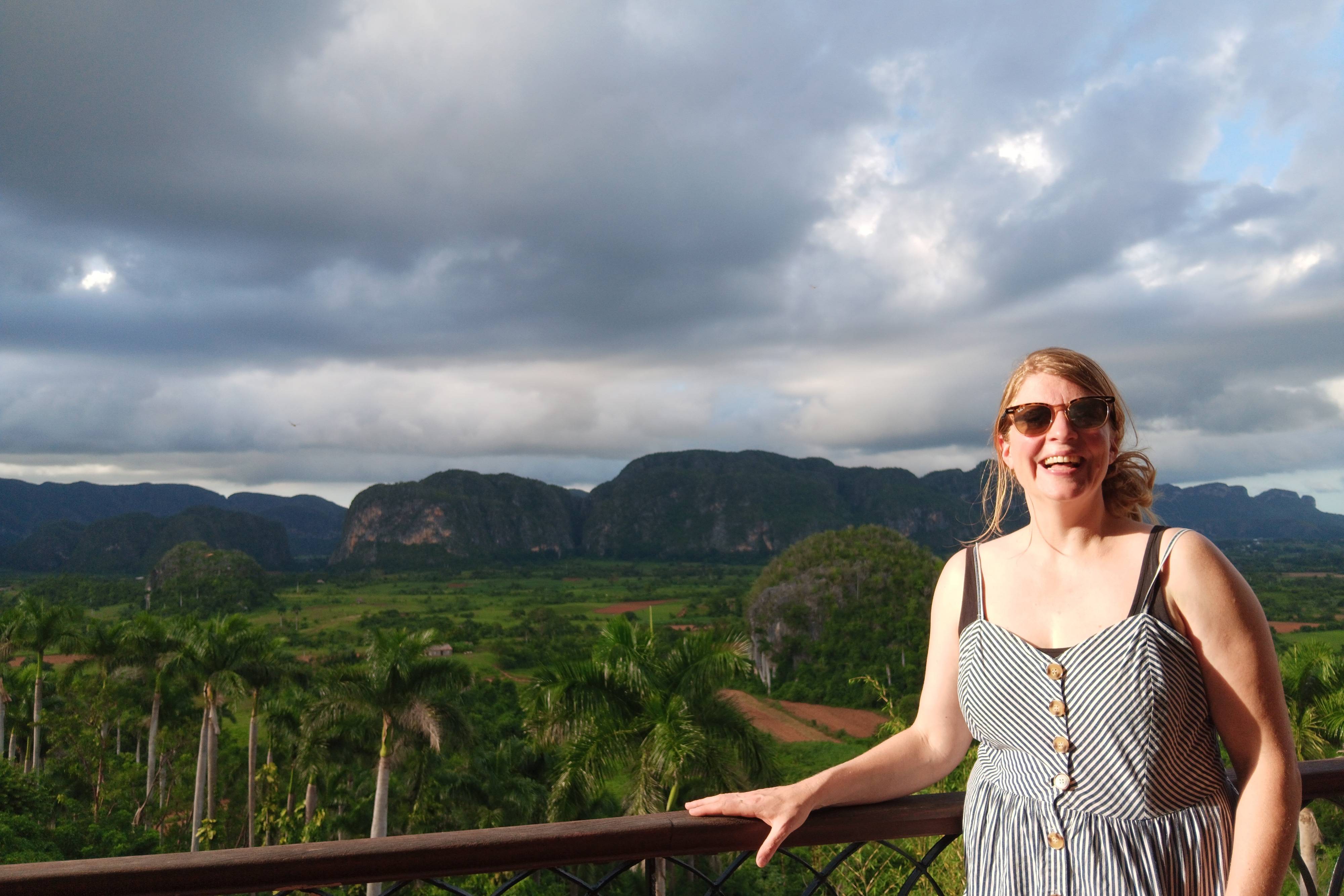 Woman standing in front of Vinales Valley Woman standing in front of Vinales Valley